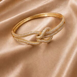 BRACELETE NÓ CRAVEJADO DOURADO